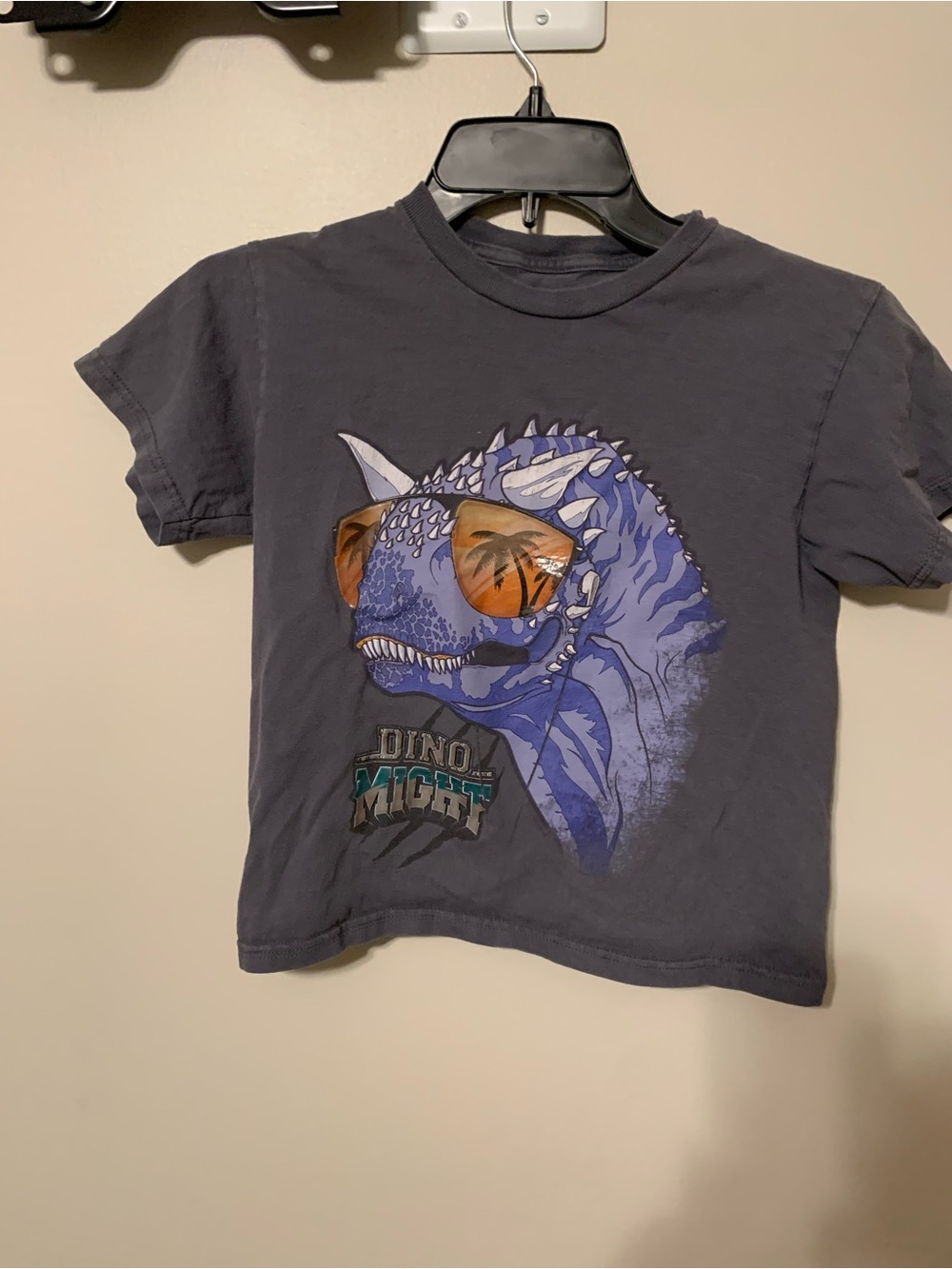 RUDE Charcoal Kids Tee with Blue Dino Wearing Orange Sunglasses. Size L/G 7